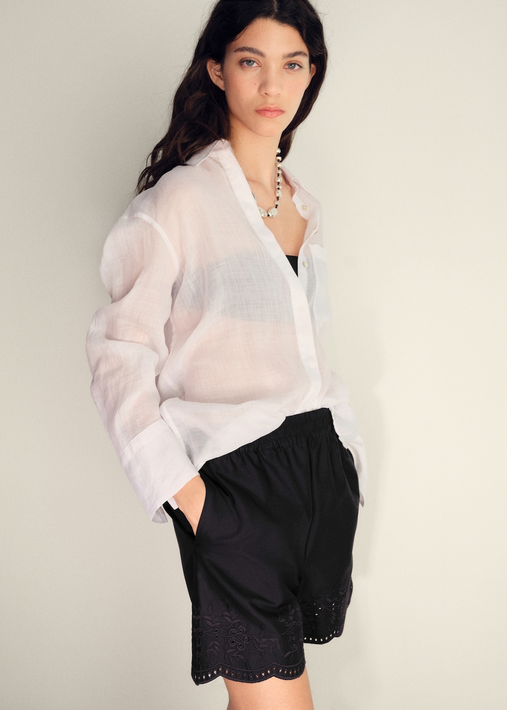 Satin shorts with embroidered hem