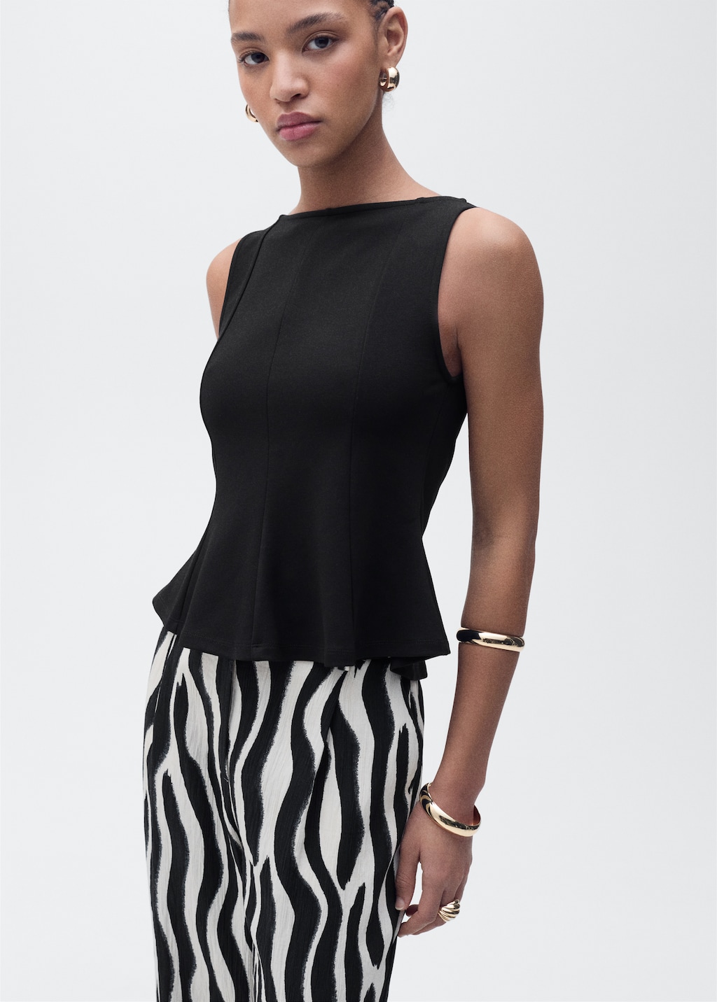 Peplum top with seam detail