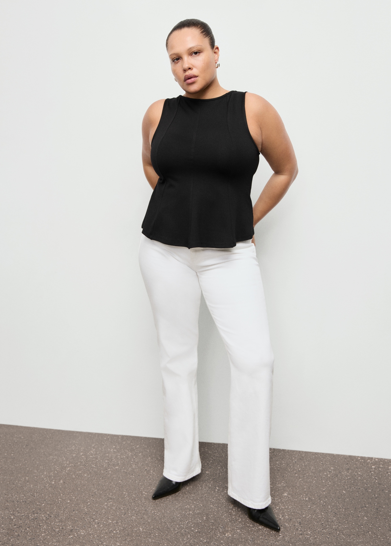 Peplum top with seam detail