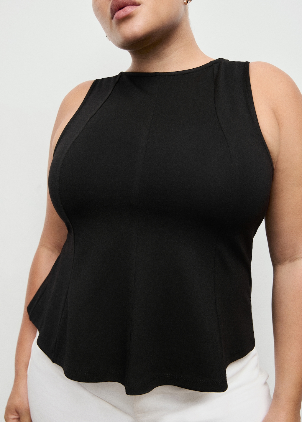 Peplum top with seam detail