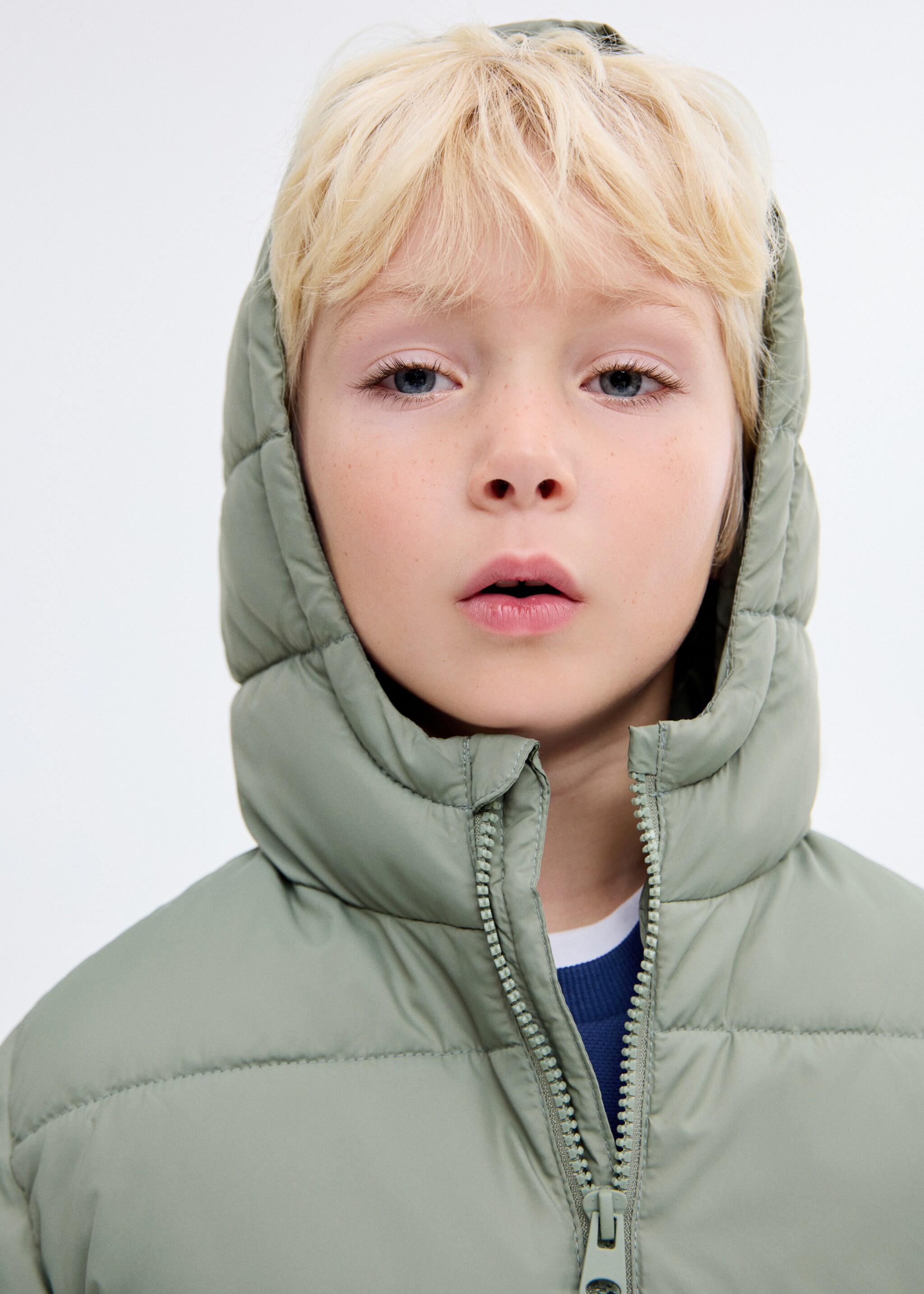 Long padded anorak with hood - Details of the article 1, Pastel Green. Ref: 17053791-00.