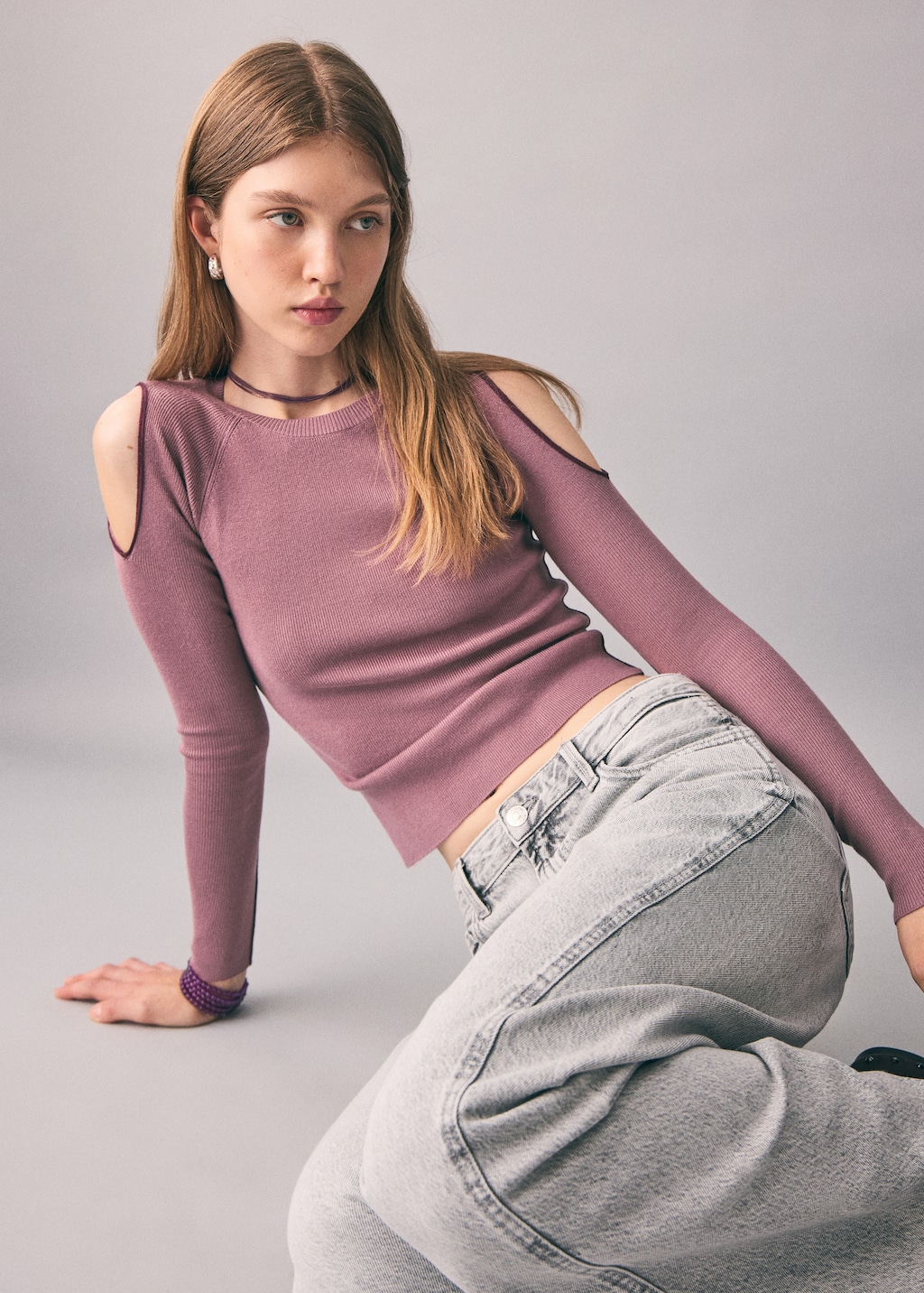 Knitted sweater with cut-out