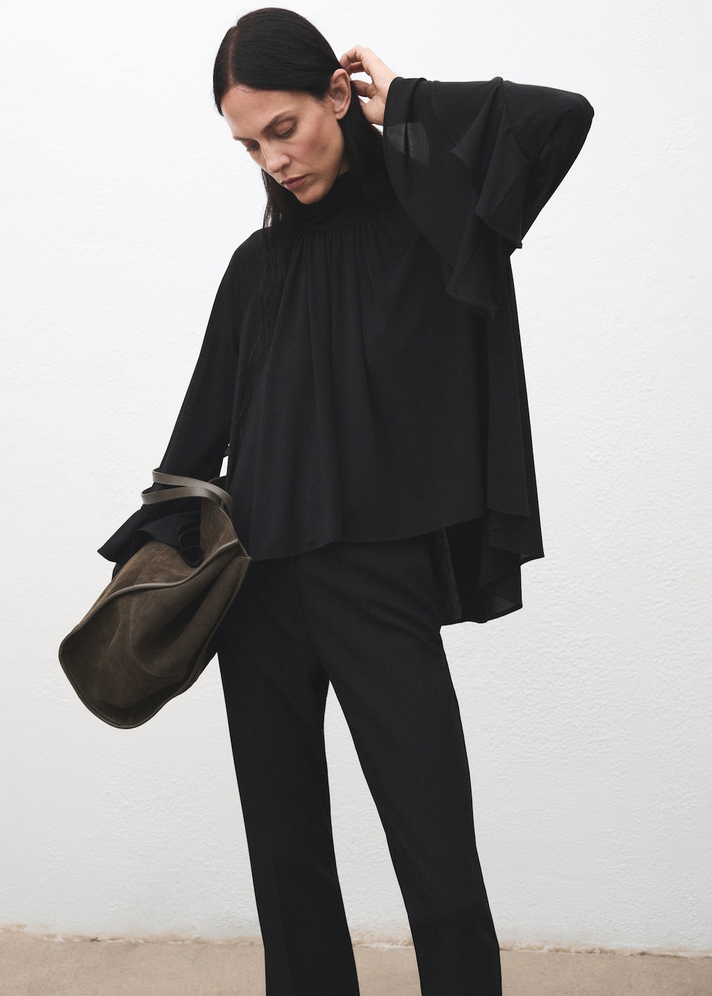 Blouse with flared sleeves and ruffles