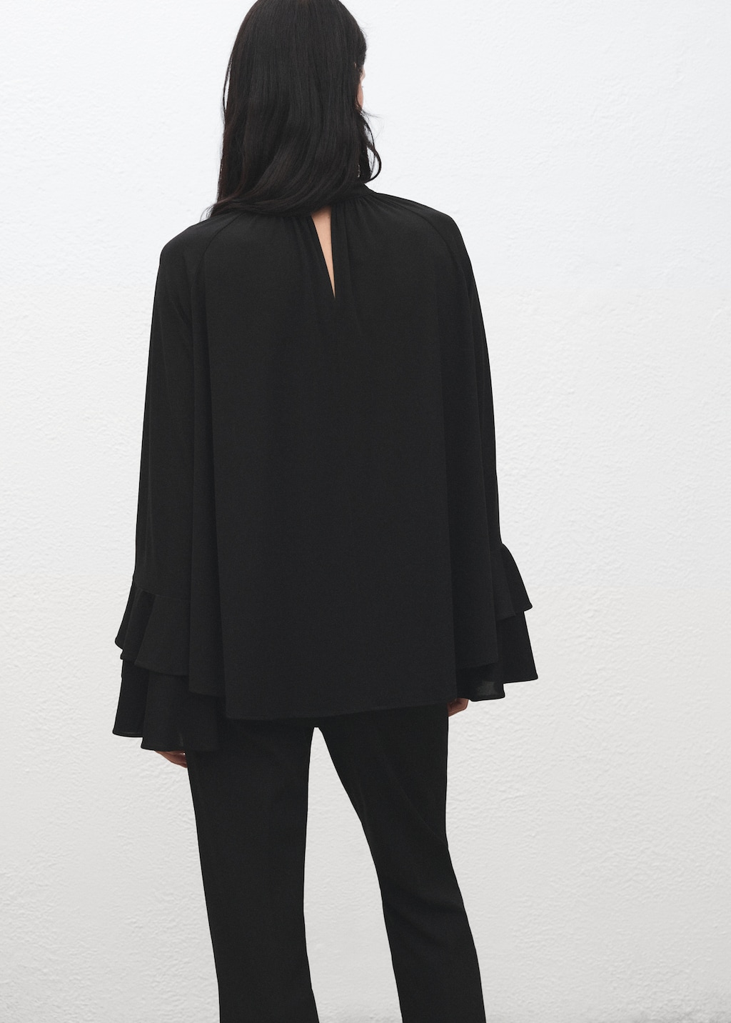 Blouse with flared sleeves and ruffles