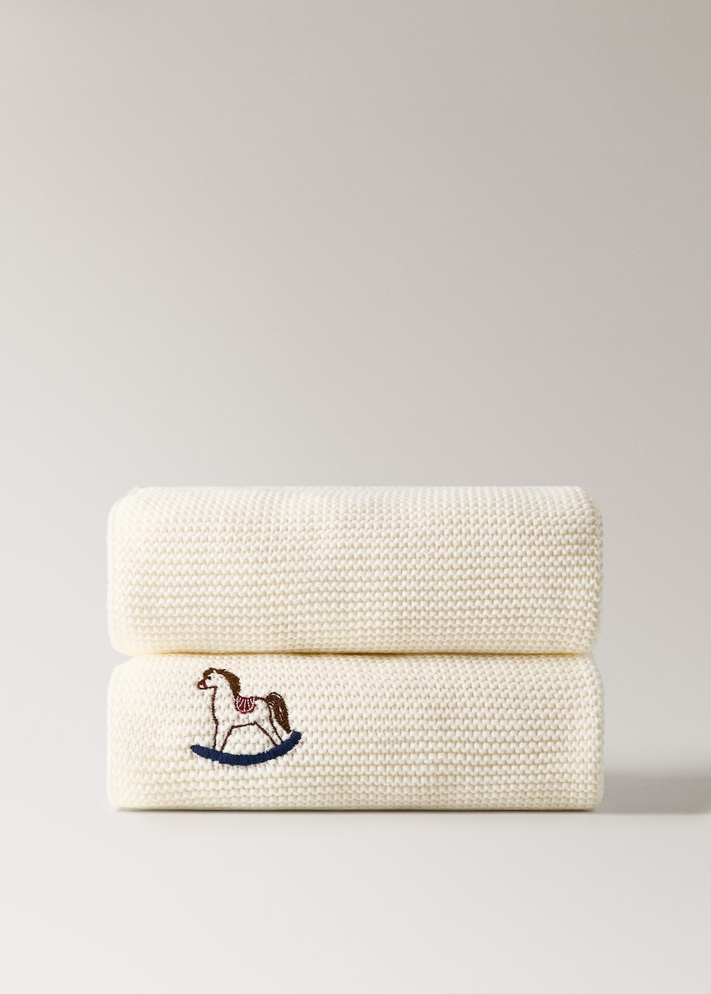 Embroidered knitted children's blanket