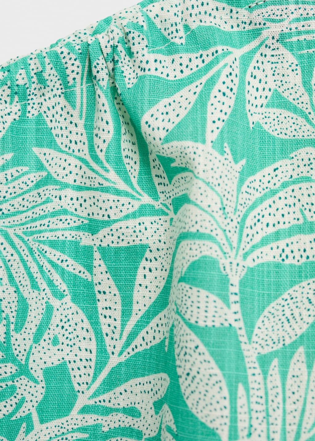 Asymmetric printed top