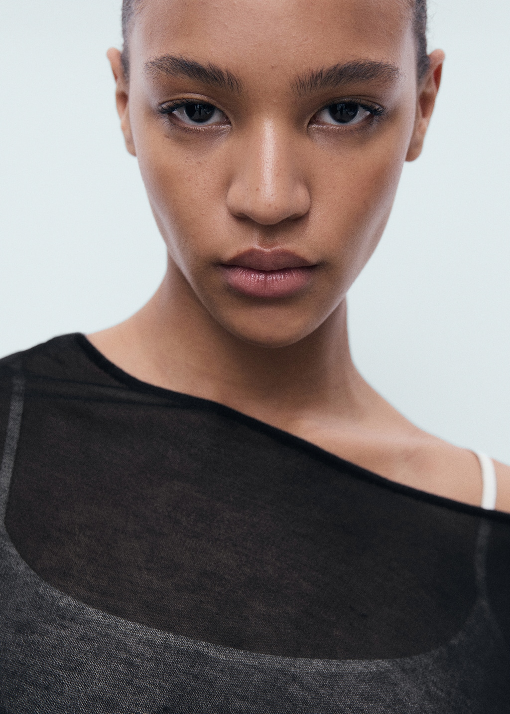 Asymmetrical knitted cape