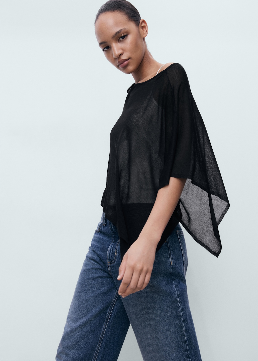 Asymmetrical knitted cape