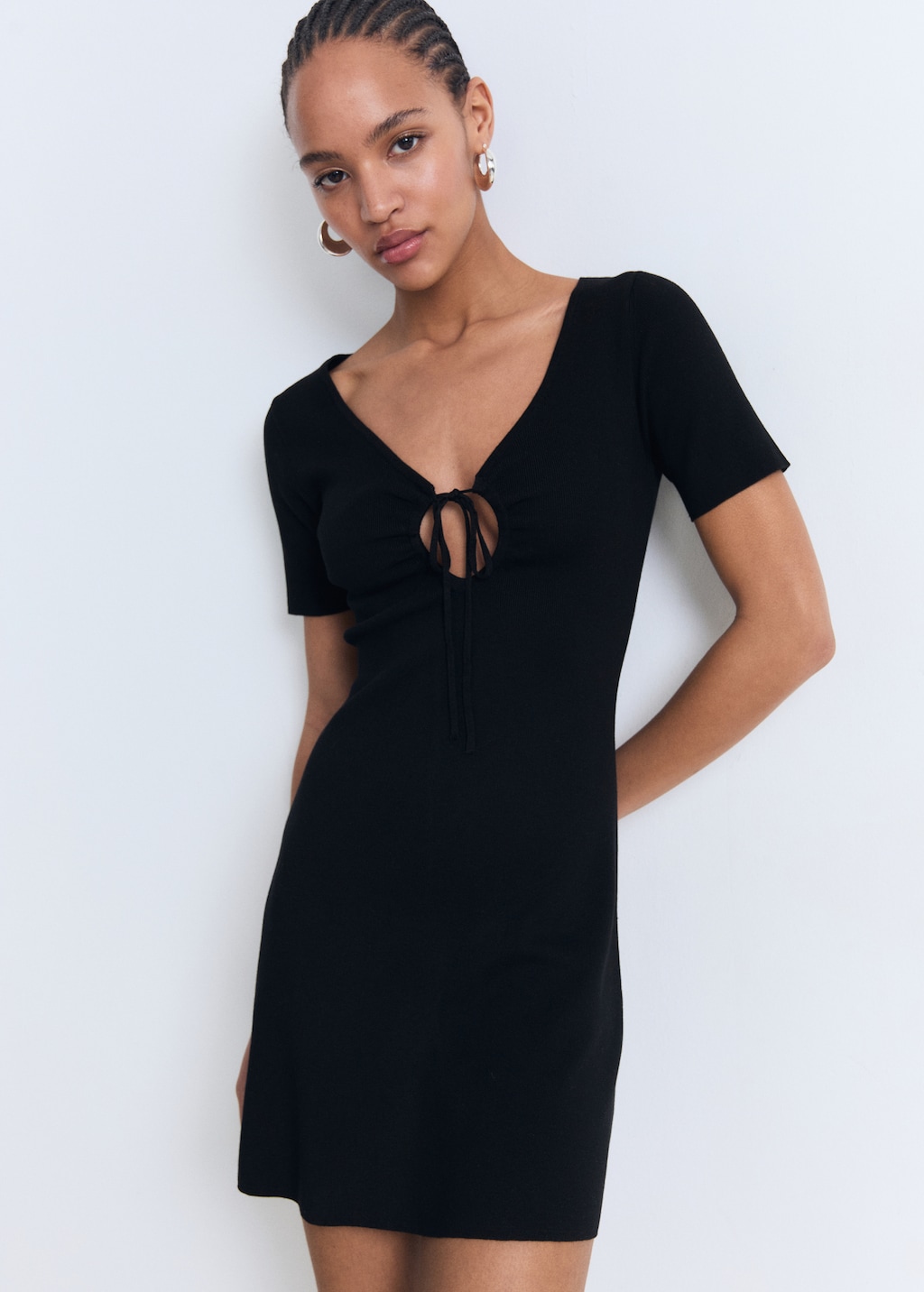 Knitted dress with bow neckline