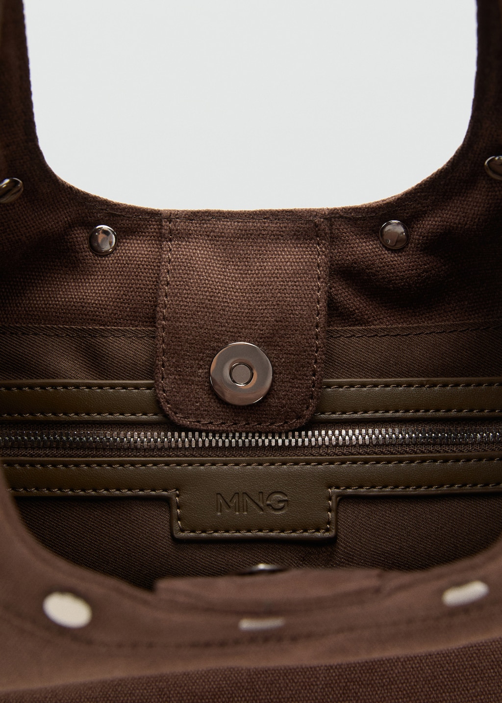 Oval studded shoulder bag