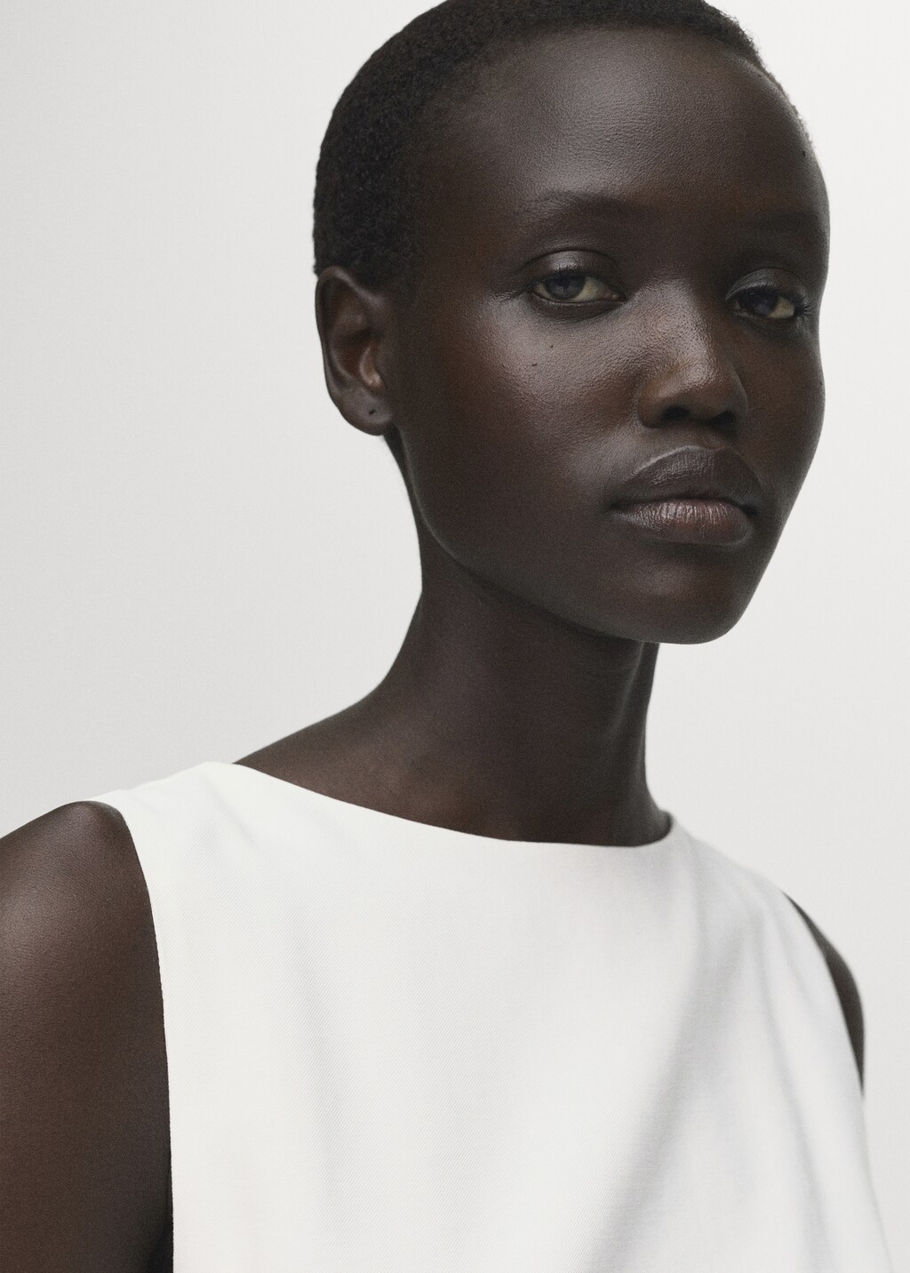 Peplum top with pleat detail