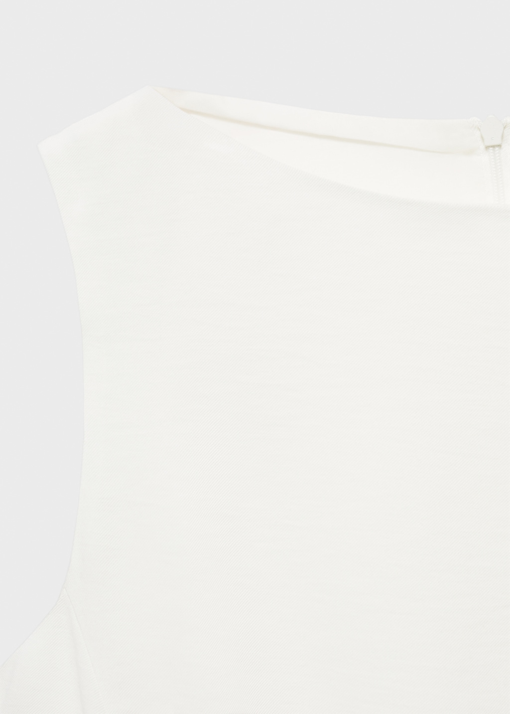 Peplum top with pleat detail