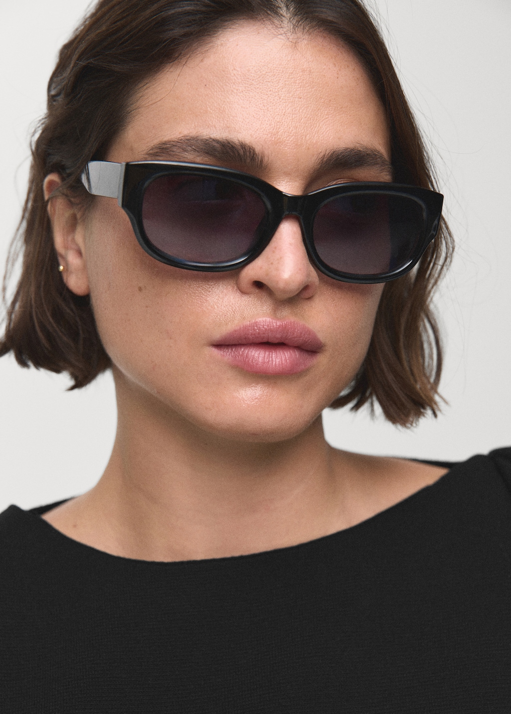 Asymmetrical knitted dress with strap