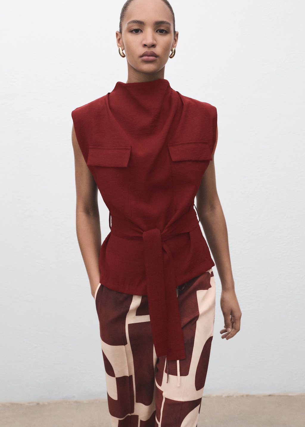Blouse with draped neck and belt