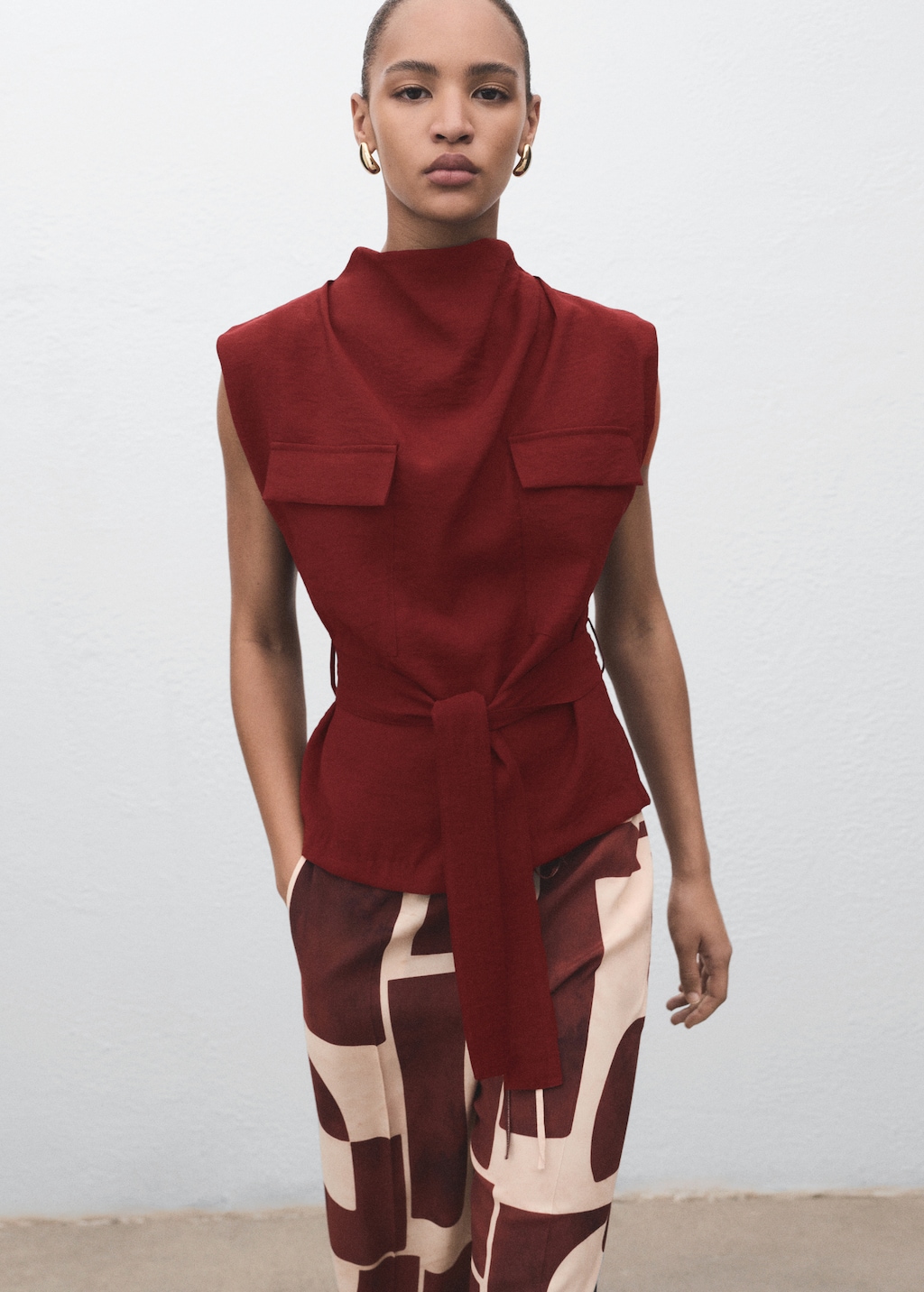 Blouse with draped neck and belt