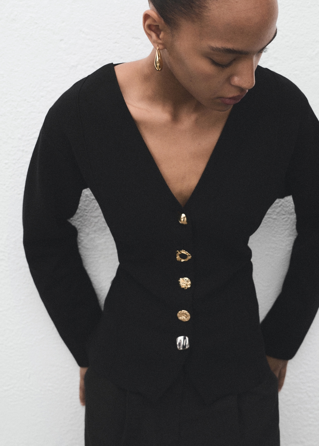 Knitted jacket with jewel buttons