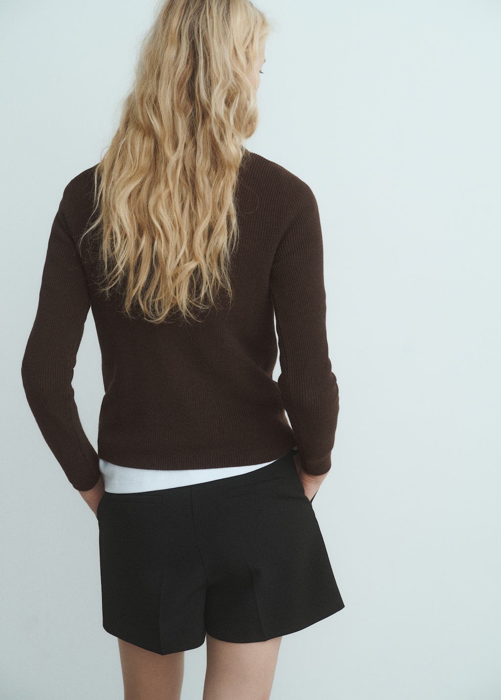 Sweater with asymmetrical neck and buttons