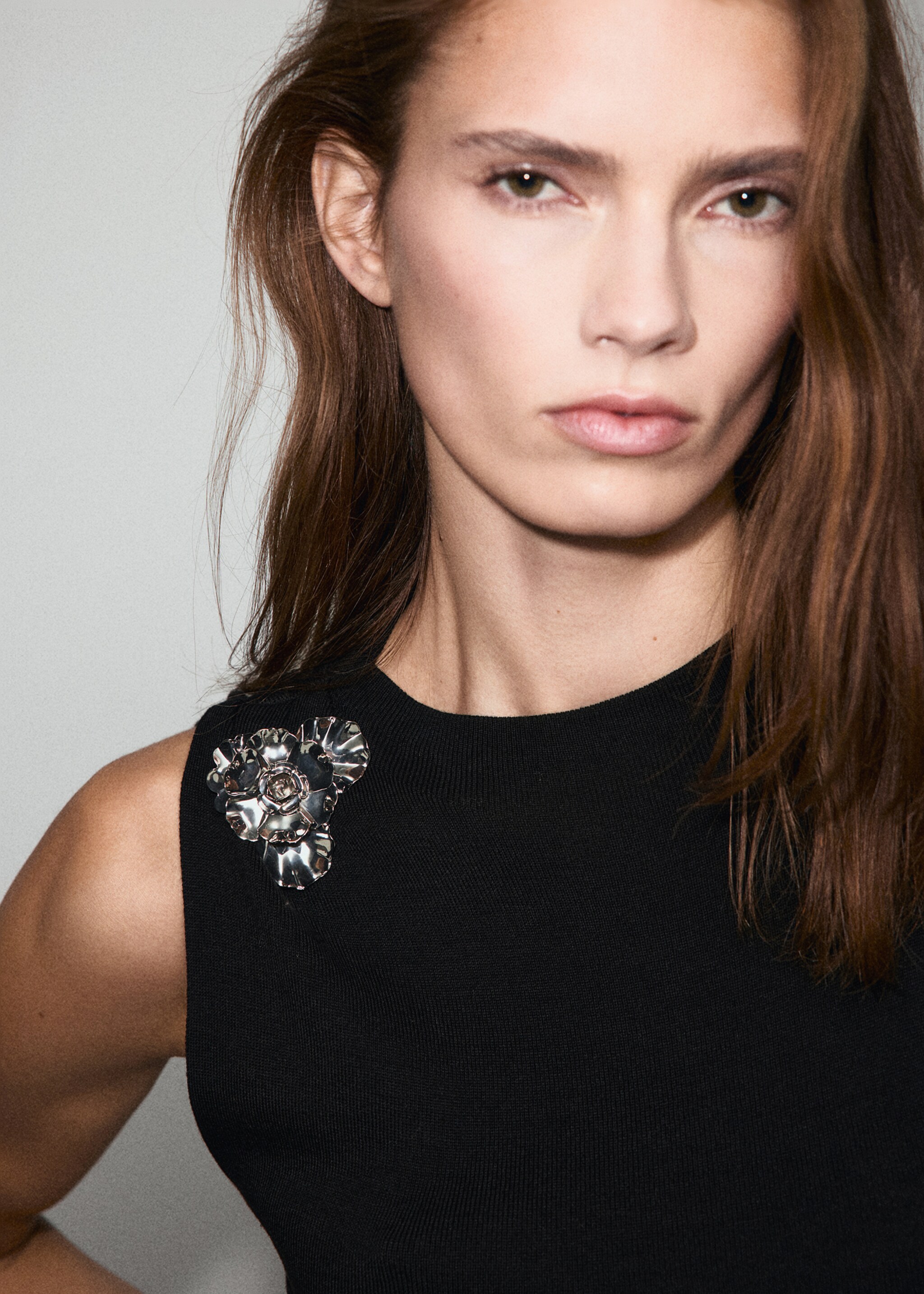 Knitted top with metallic flower - Details of the article 1, Black. Ref: 17069114-00.