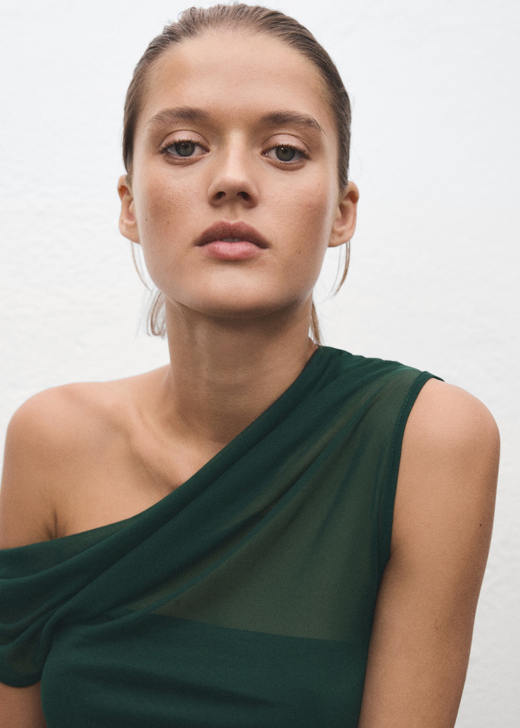 Semi-transparent top with asymmetrical neckline