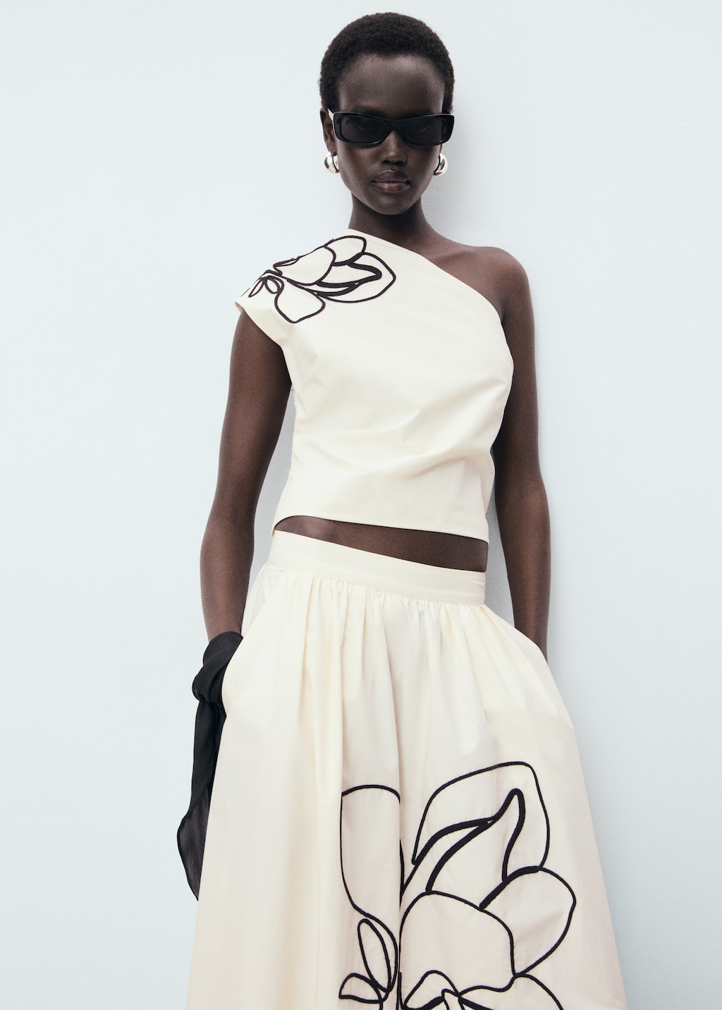 Asymmetrical flower-embroidered top