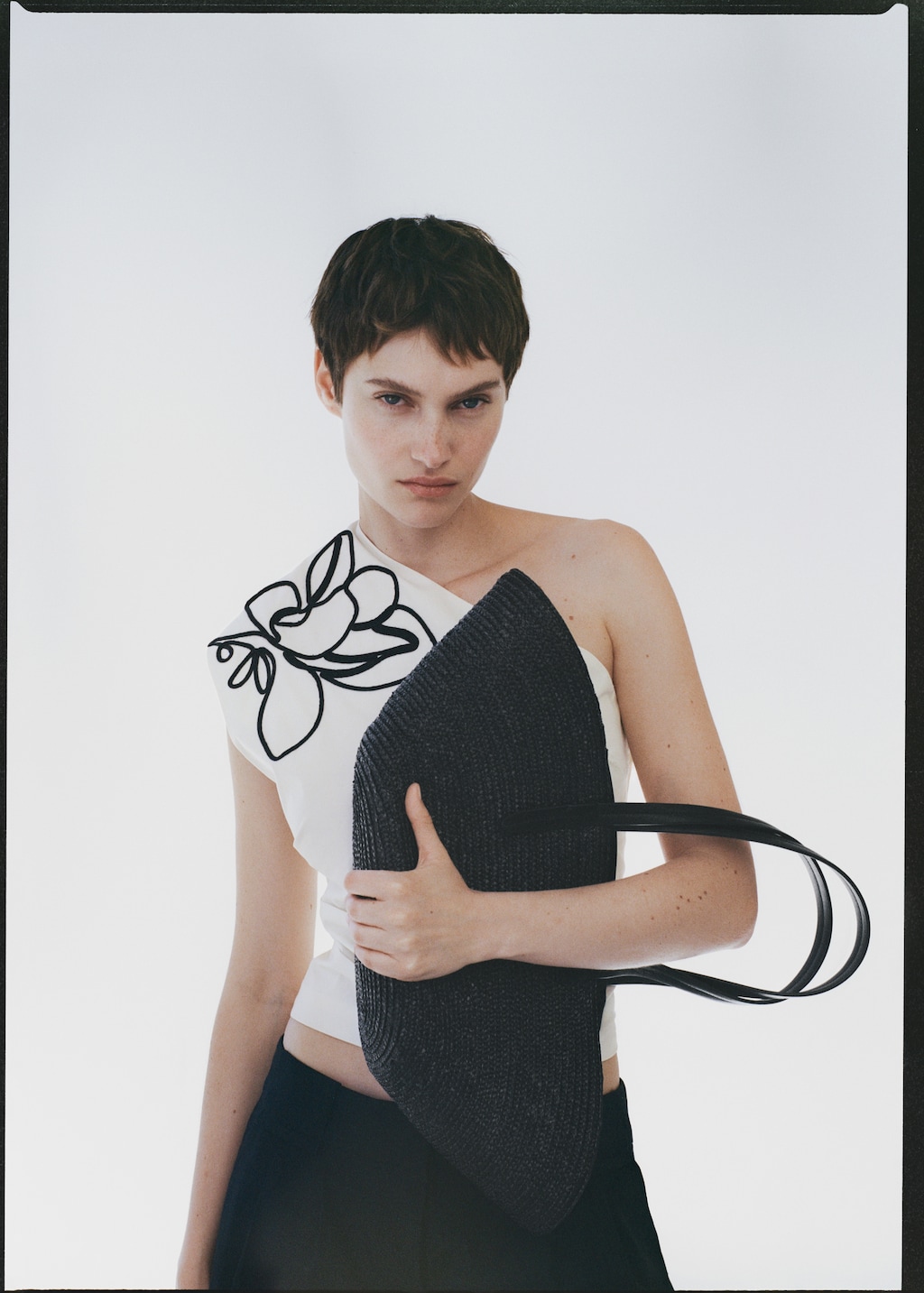 Asymmetrical flower-embroidered top