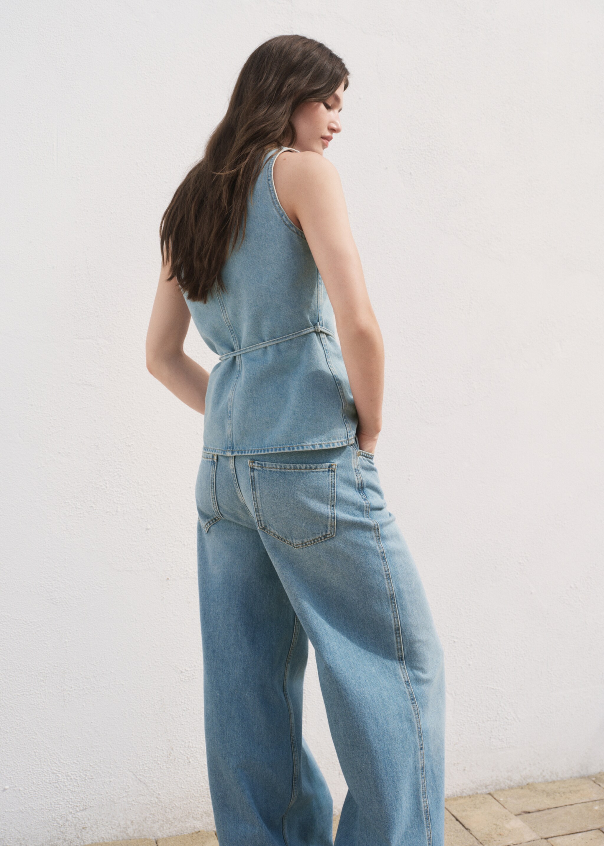 Buttoned denim gilet - Reverse of the article