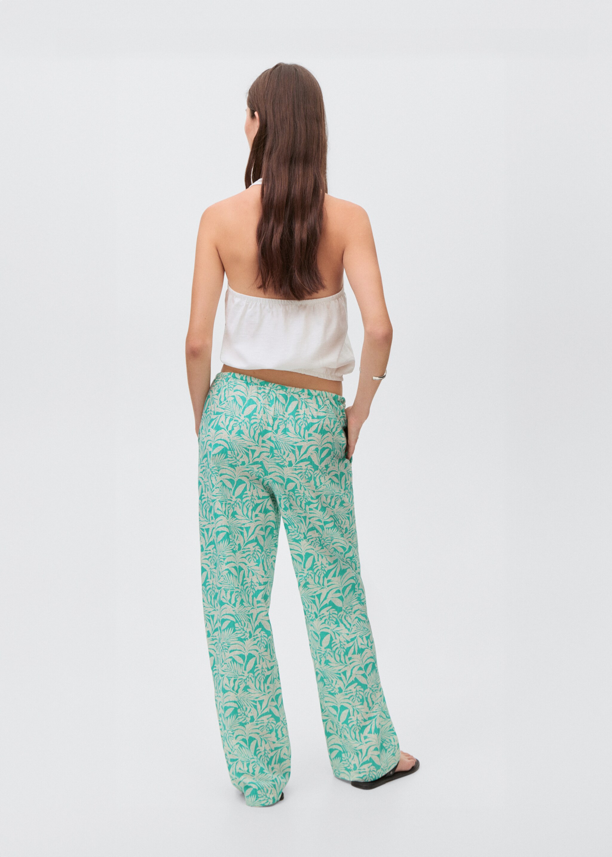 Cotton trousers with leaf pattern - Reverse of the article