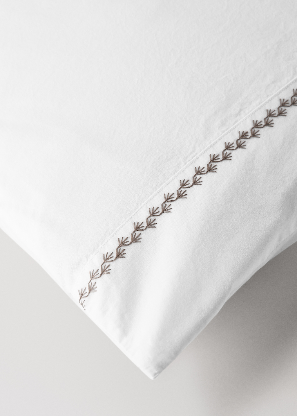 200-thread count percale cotton pillowcase in with embroidered detail for cot