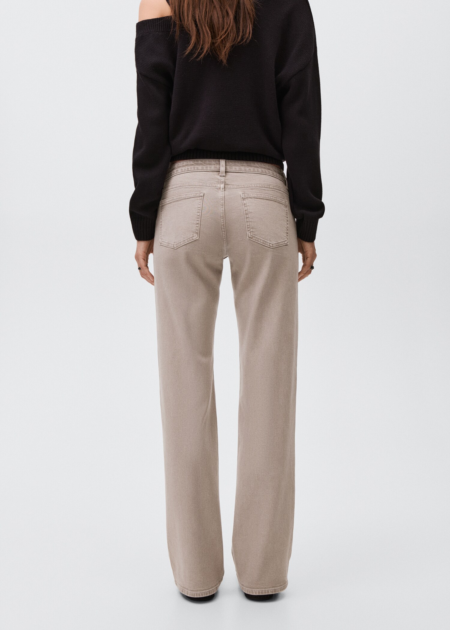 Low-waist studded jeans - Reverse of the article