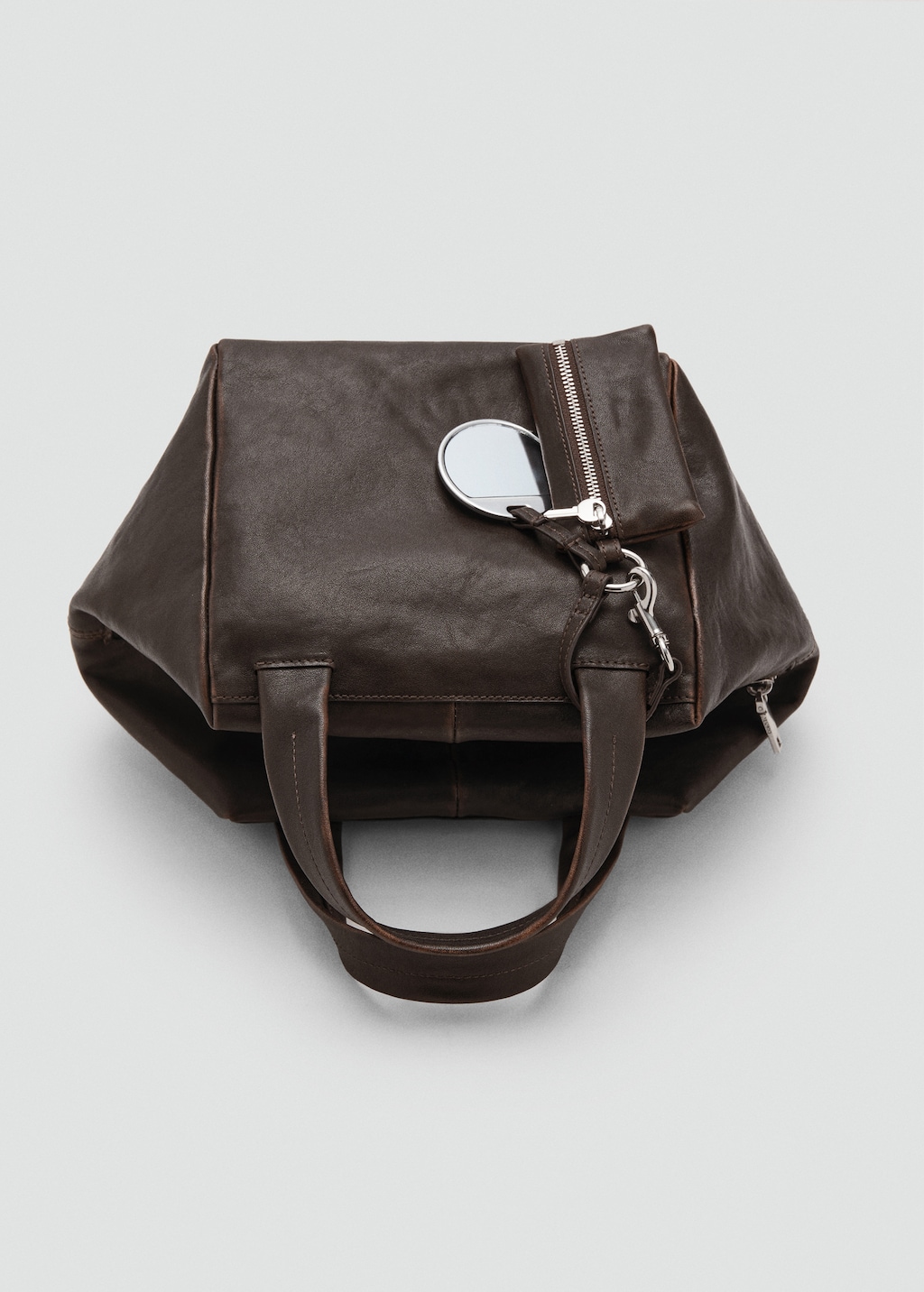 Leather clutch bag with charms