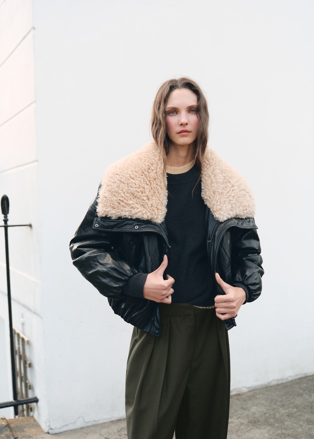 Pleated trousers with button detail