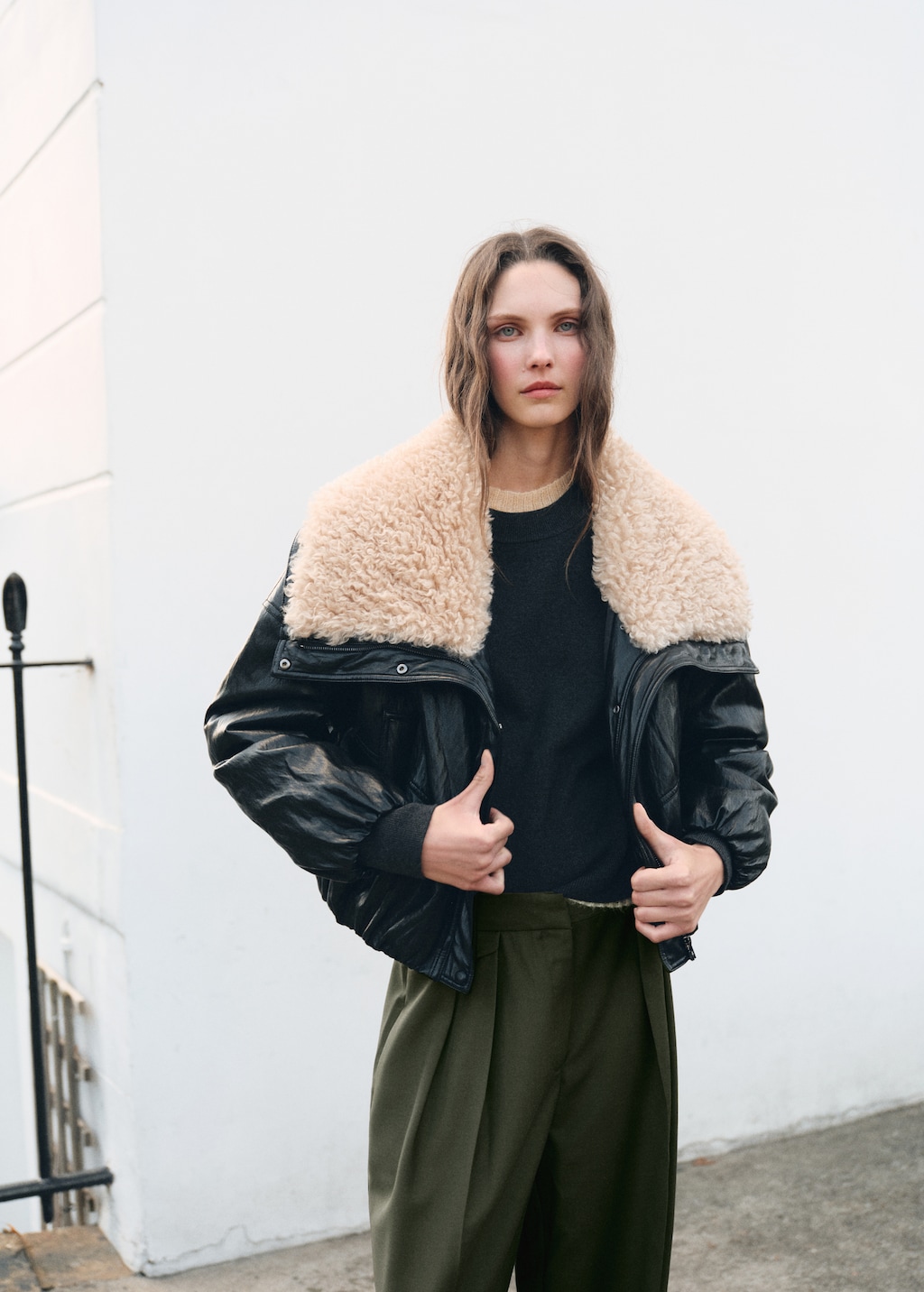 Pleated trousers with button detail