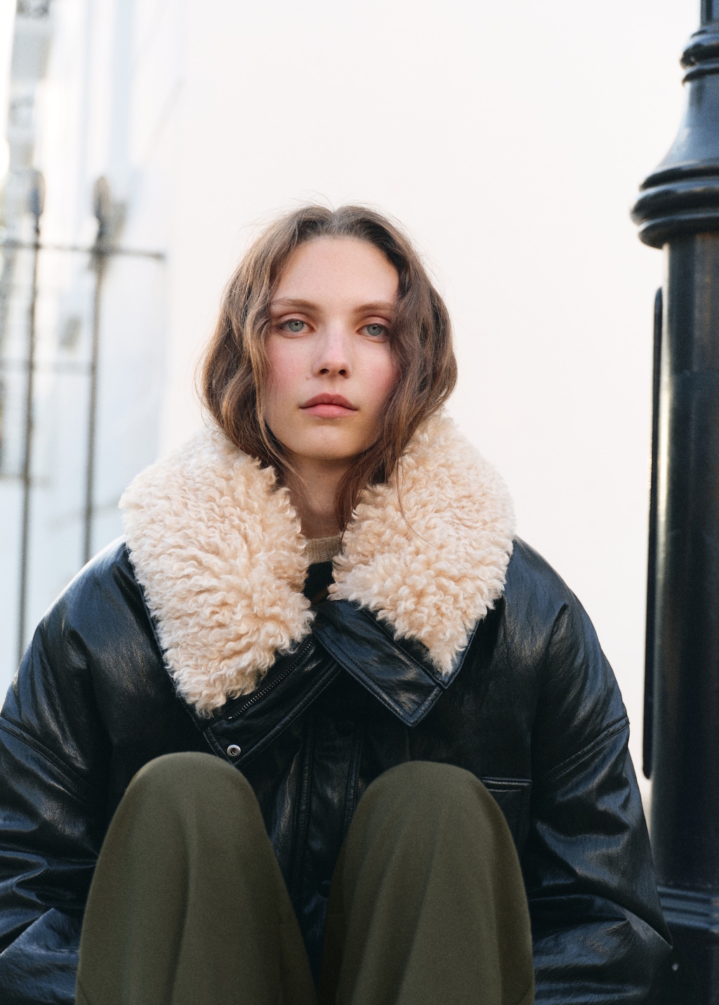 Pleated trousers with button detail