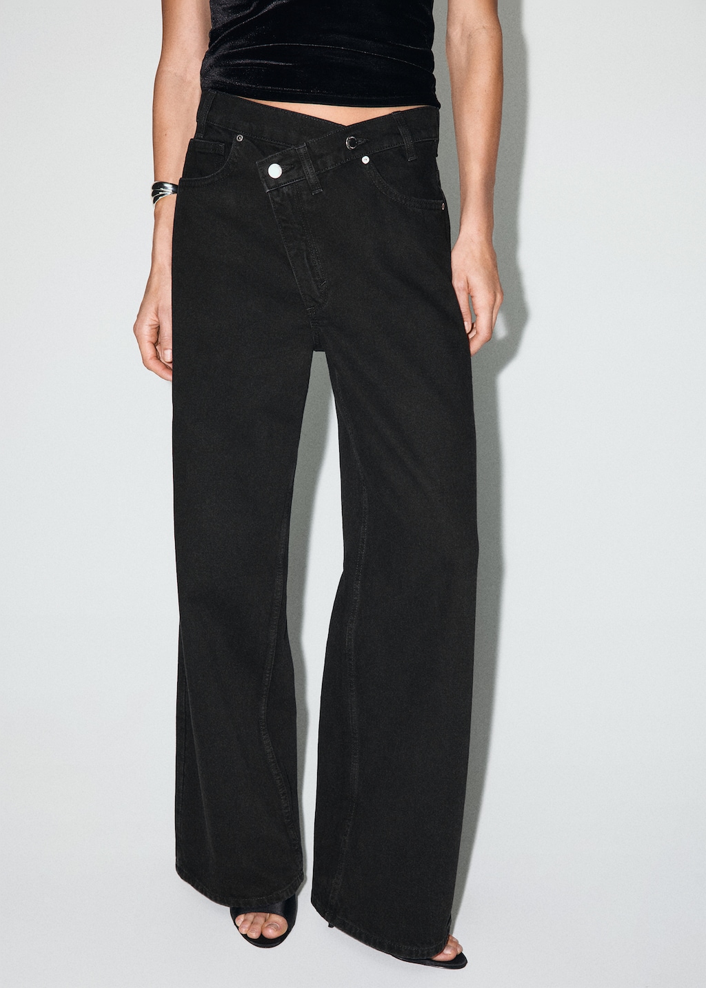 Wide-leg mid-rise jeans with a crossover waistband