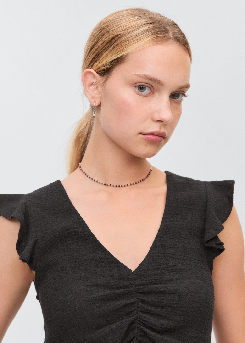 Ruffled-sleeve blouse