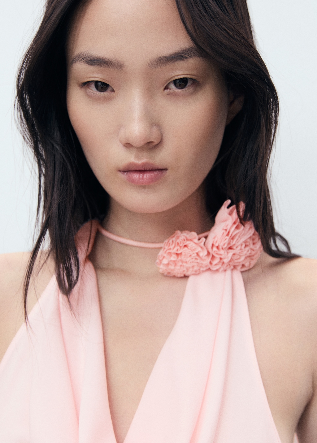 Draped blouse with flower detail