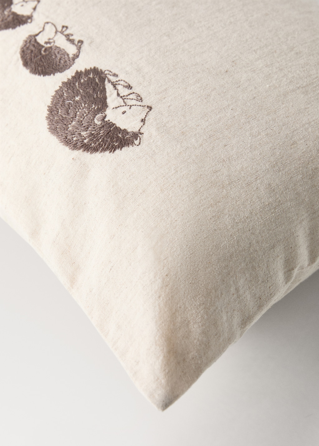Children's cotton-linen cushion cover with embroidered hedgehogs