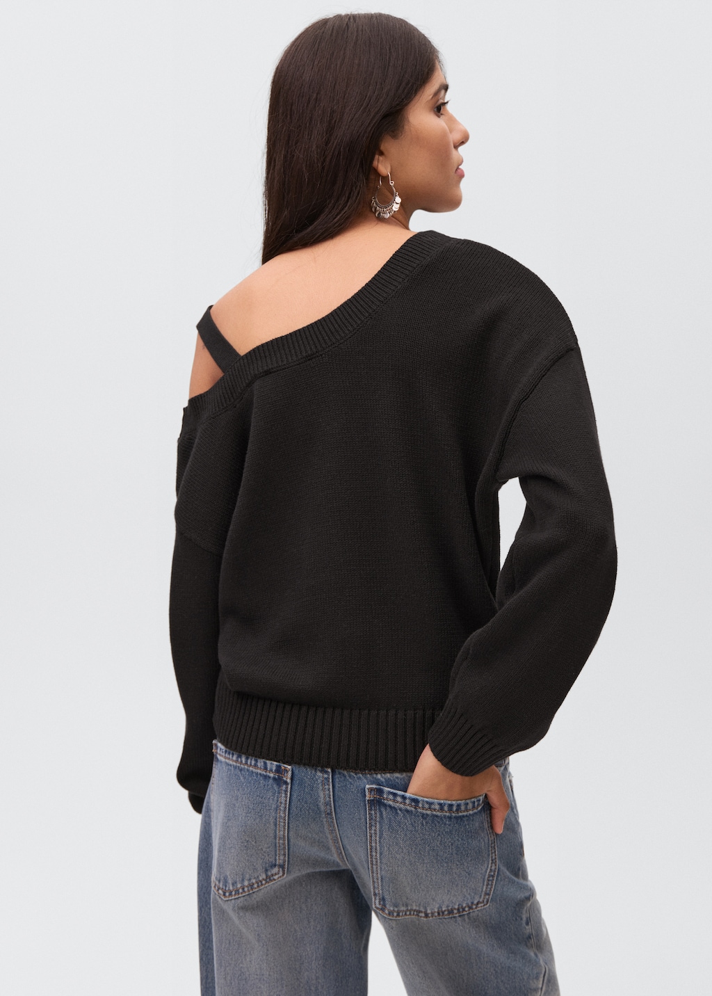 Knitted sweater with cut-out