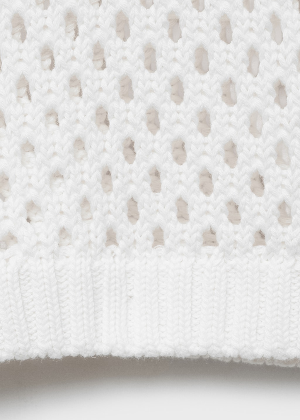 Knit sweater with lace pattern