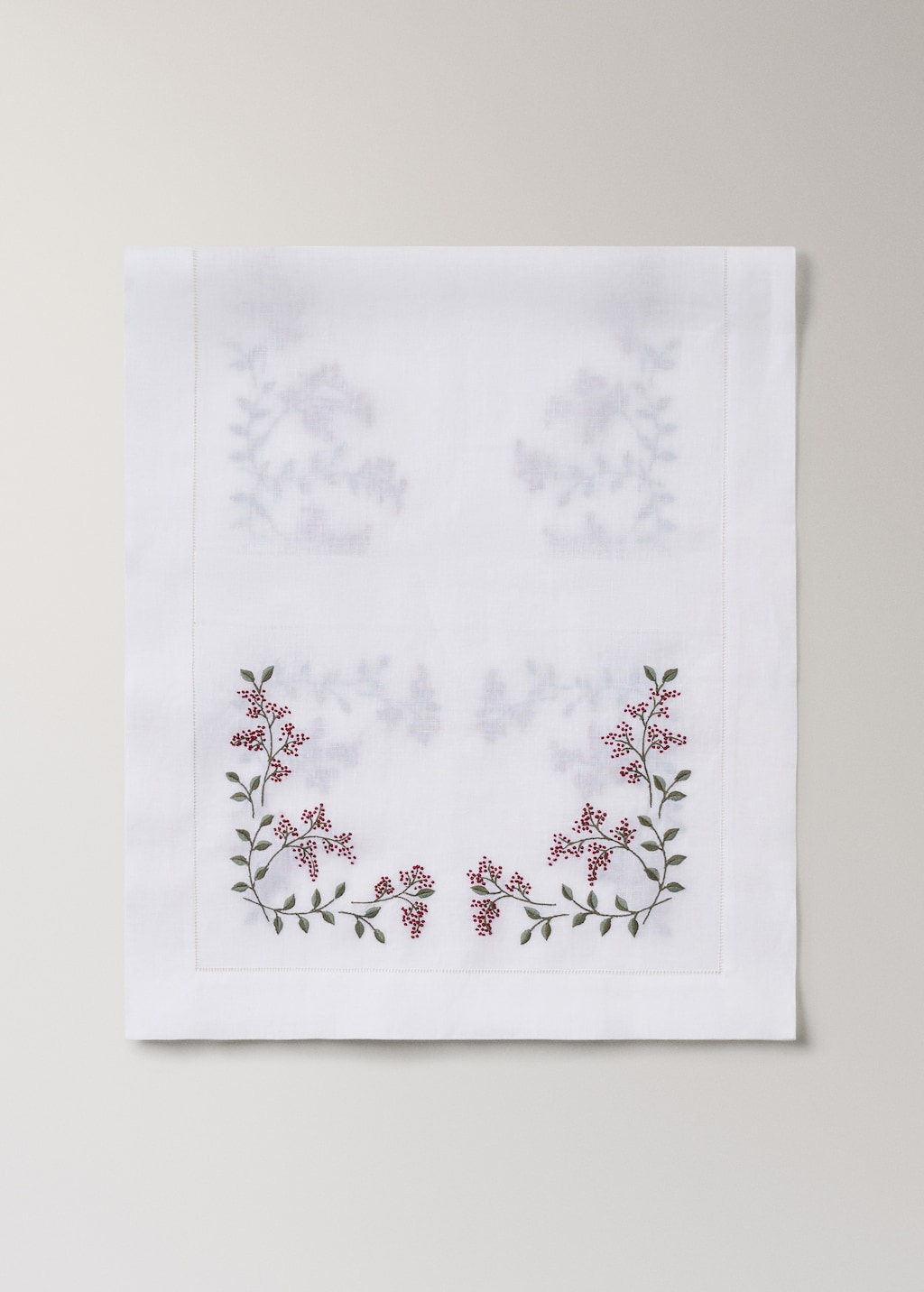 Linen table runner with embroidered floral Christmas designs