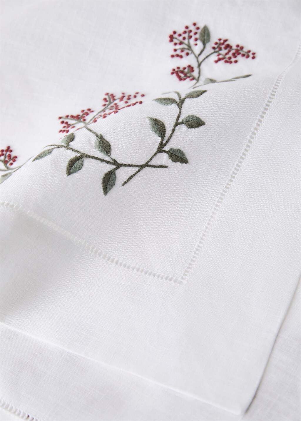 Linen table runner with embroidered floral Christmas designs