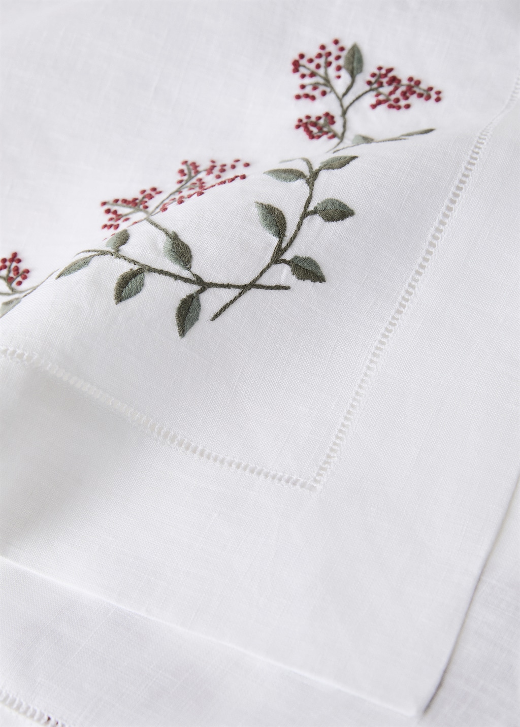 Linen table runner with embroidered floral Christmas designs