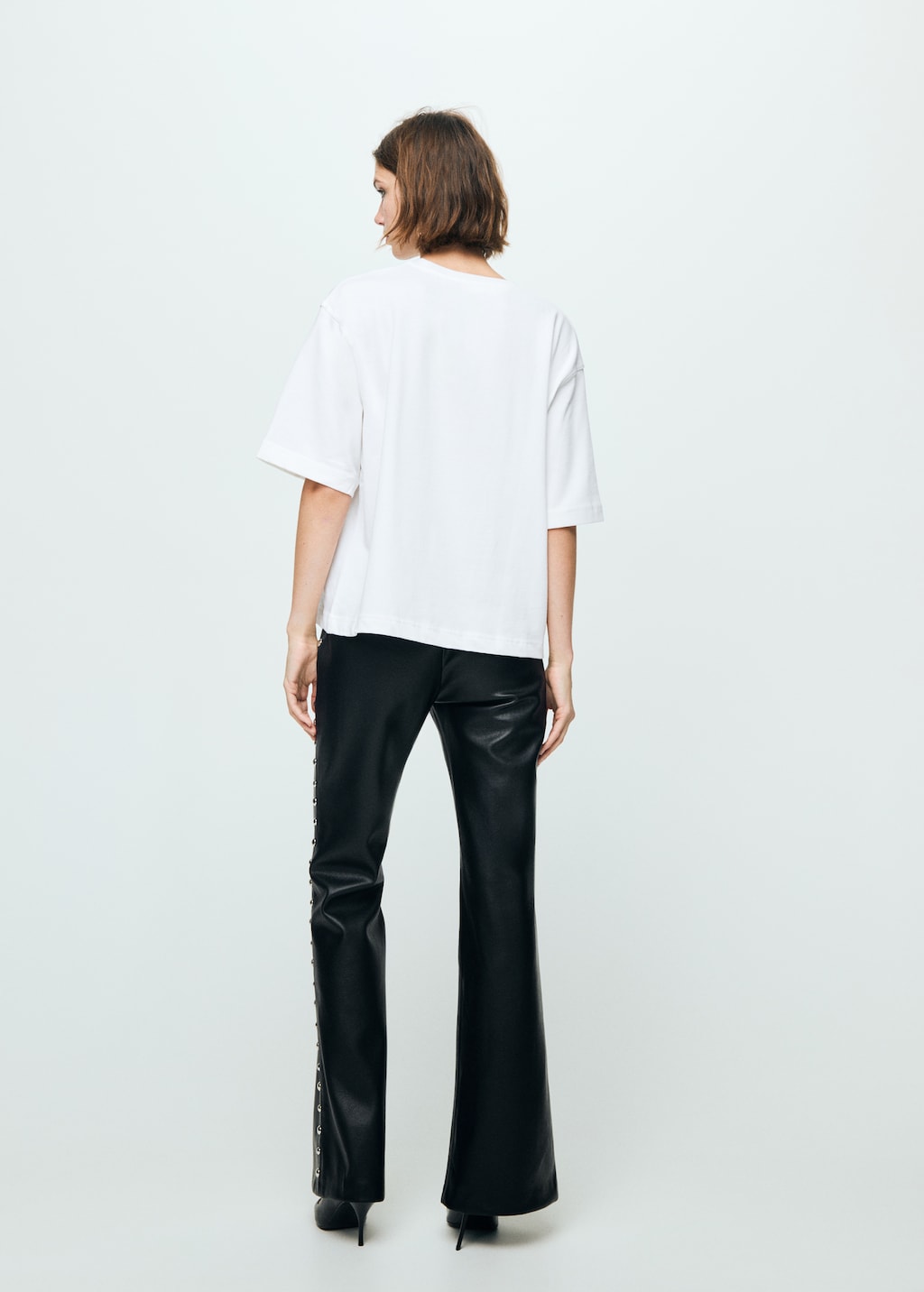 Studded faux-leather trousers