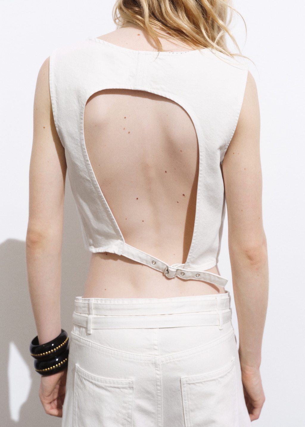 Denim crop top with buckle closure