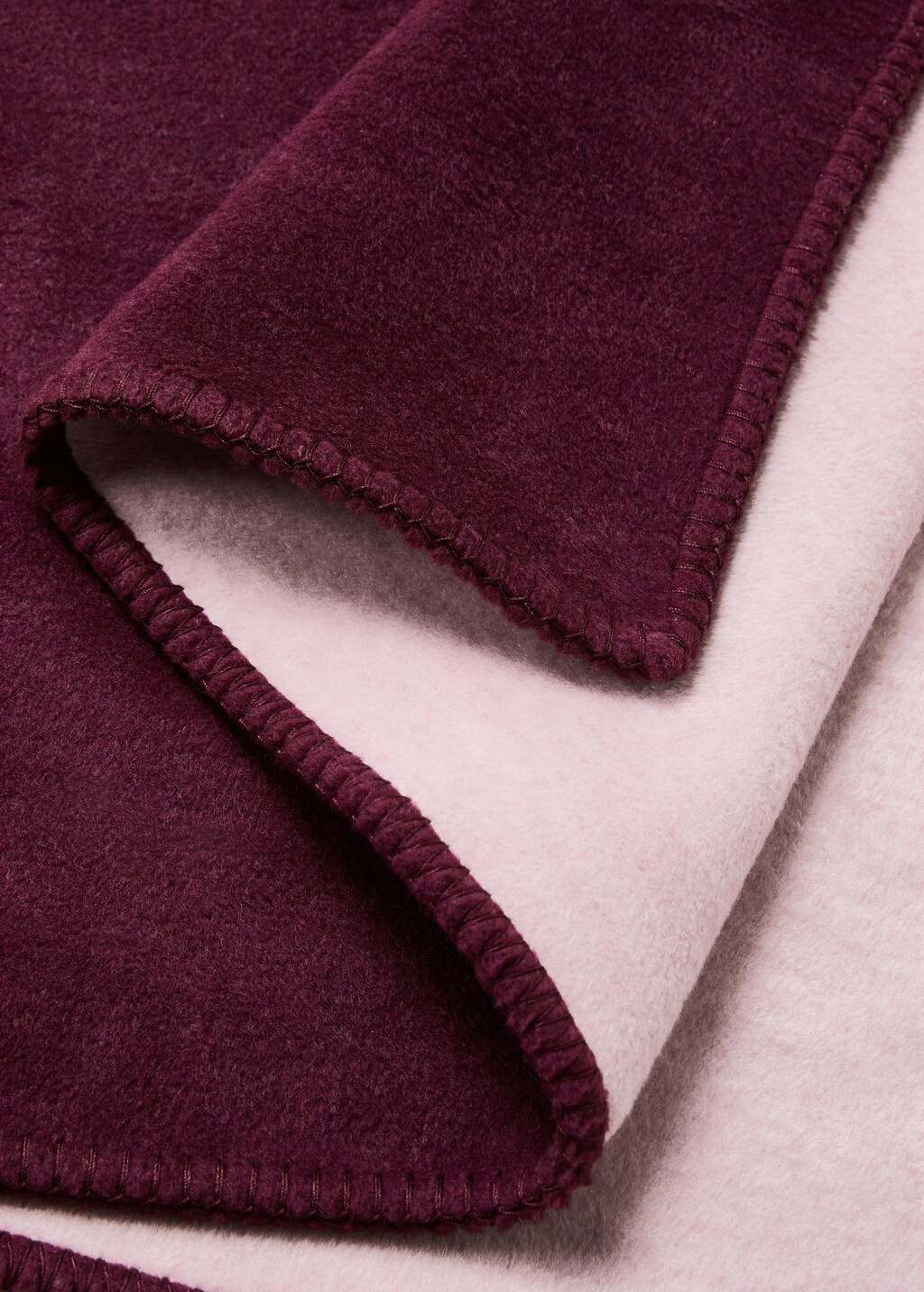 Soft fleece blanket with saddle-stitch detail