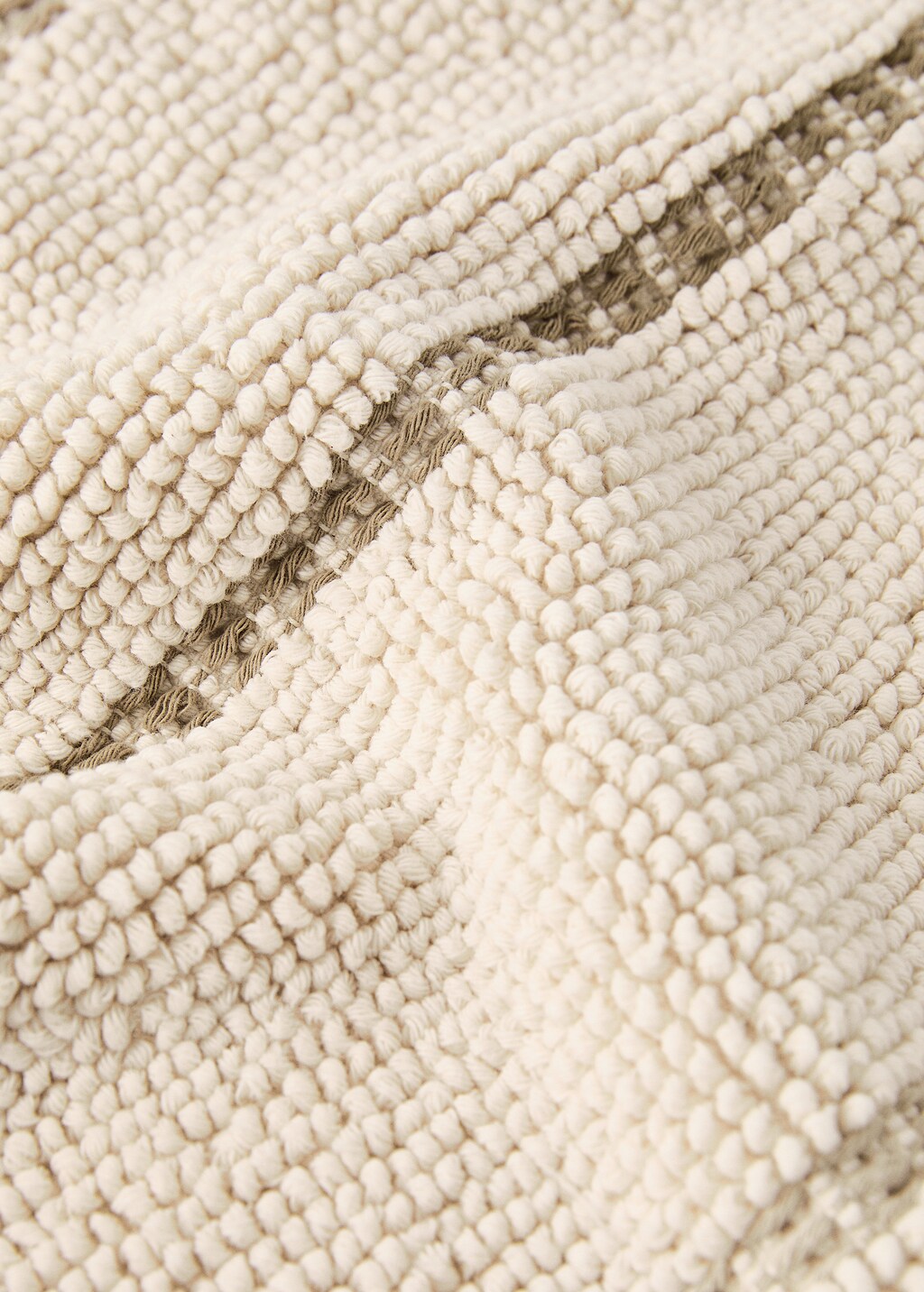 Striped bath mat with fringe detail