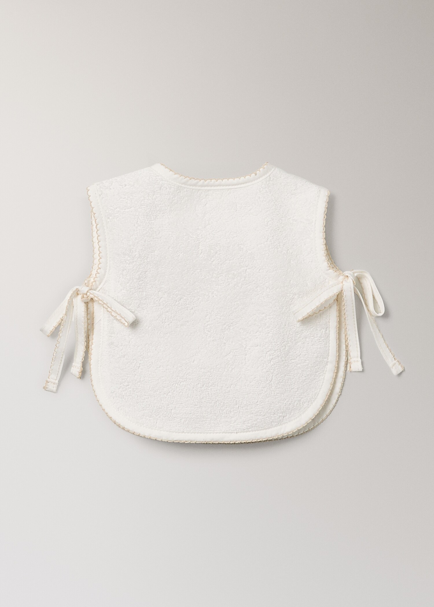 Bavoir en coton avec bordure décorative - Détail de l'article 1