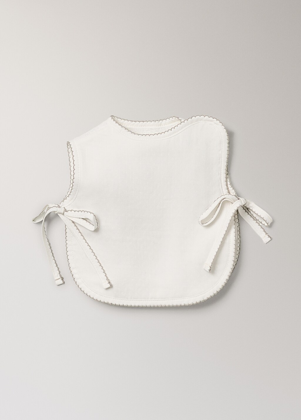 Cotton bib with decorative trim