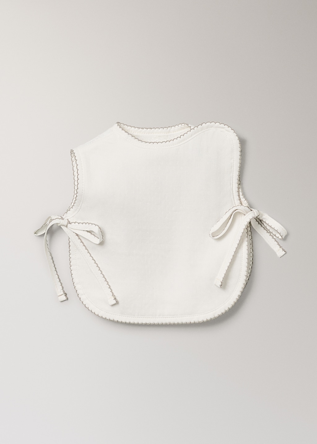 Cotton bib with decorative trim