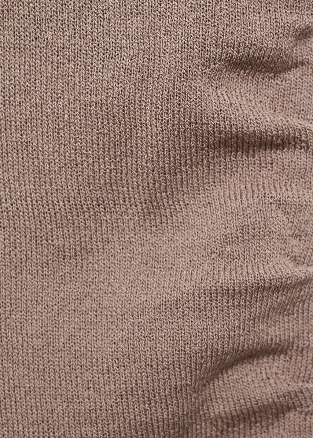 Asymmetrical knitted top with straps